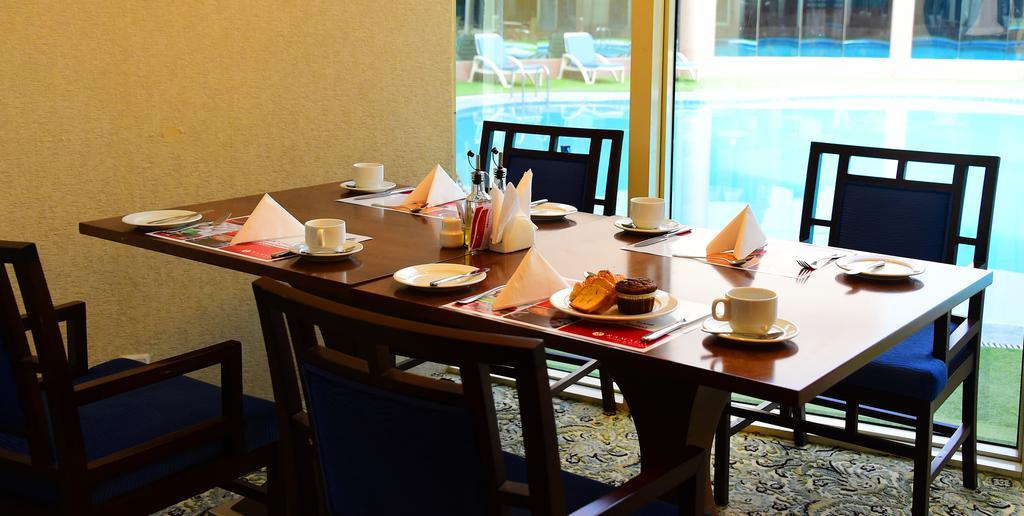 Ramada Hotel & Suites By Wyndham Al Qassim Al Bukayriah Exterior foto A table set for afternoon tea